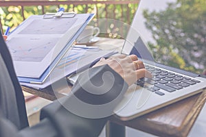 Close up of married woman hand typing laptop keyboard