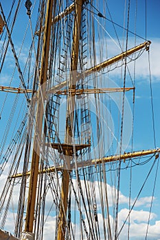 Close-up of a mast on traditional sailboats. The mast of large wooden ship. Beautiful travel picture with masts and rigging of