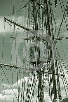 Close-up of a mast on traditional sailboats. The mast of large wooden ship. Beautiful travel picture with masts and rigging of