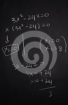 Close up math formulas written on a blackboard. Education concept