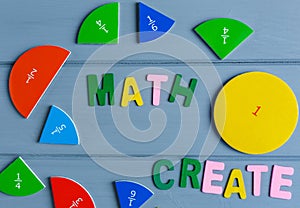 Close up mathematical fractions and colorful letters on gray background. Creative, fun mathematics banner. Education,