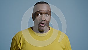 Close-up mature athletic african american man in studio gray background exhale after hard workout sporty male middle