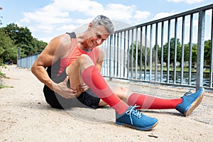 Man With Sprain Thigh Muscle photo