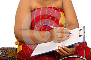 Close up of a mature woman with notepad