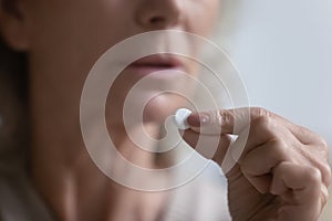 Close up of mature woman think of having medicines