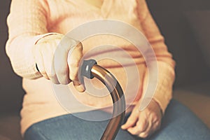 Close up of mature womans hands. Health care giving, nursing home. Parental love of grandmother. Old age related diseases.