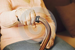 Close up of mature womans hands. Health care giving, nursing home. Parental love of grandmother. Old age related diseases.