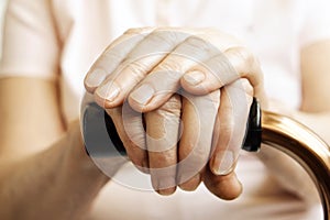 Close up of mature womans hands. Health care giving, nursing home. Parental love of grandmother. Old age related diseases.