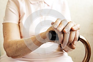 Close up of mature womans hands. Health care giving, nursing home. Parental love of grandmother. Old age related diseases.