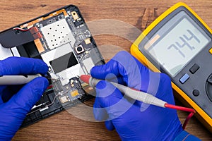 Close-up of measurements, in the process of detecting mobile device malfunctions and further repairs photo