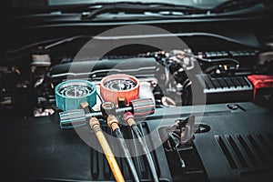Close up measuring manifold gauge for mechanic check the refrigerant and filling car air conditioner for fix and checking for