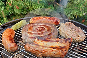 Close-up Of Meat Assortment On Hot BBQ Grill