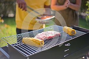 Close-up of meat and corn on BBQ
