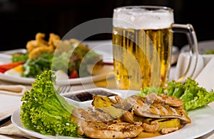 Close up Meat and Vegetable Dish with Beer