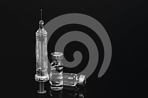 Close up of a Medical vials for injection with a syringe and ampules