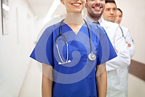 Close up of medics or doctors at hospital corridor