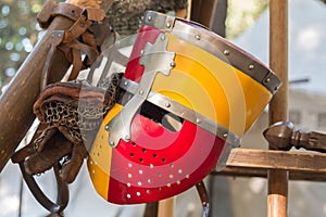 Close up of Medieval Knight`s Silver Helmet in Red and Yellow