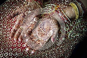 Close up of Mehndi tattoos on the hands of a Hindu or Sikh bride