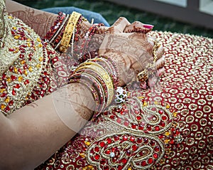 Close up of Mehndi tattoos on the hands of a Hindu or Sikh bride