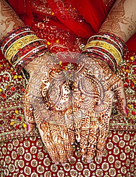 Close up of Mehndi tattoos on the hands of a Hindu or Sikh bride