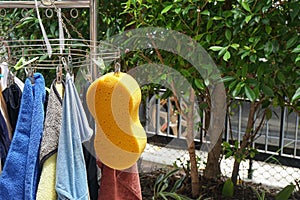 Close up men underwear and cleaning sponge hanging outdoors for drying