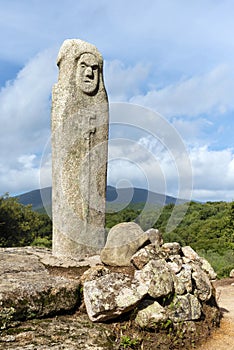 Close-up of a menhir with a human face carved on the megalithic site of Filitosai, Corsica, France