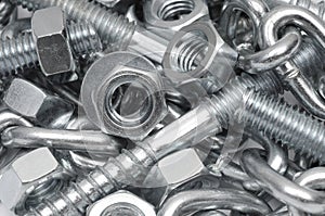 Close-up of metal bolts, nuts and chain. Technology background