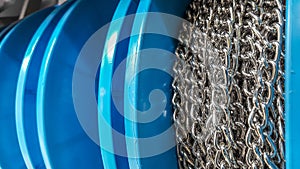 Close up of metal chains wrapped on coil