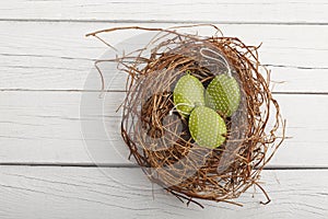 Close-up of metal easter eggs in nest