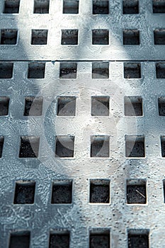 Close-up of Metal Grate With Holes. Generative AI