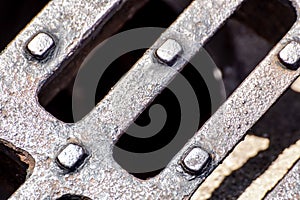 Close up of Metal grille of sewer, Pattern of square grate, Manhole drain cover in concrete road