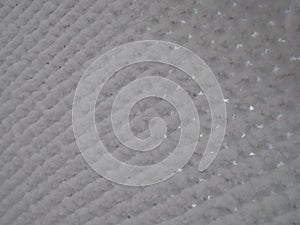 close-up metal mesh covered with a thick layer of snow in the cells