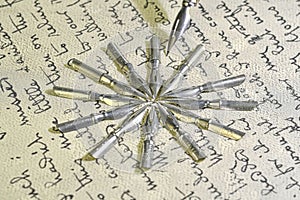 Close-up of metal nibs and old pen on vintage handwriting. Fountain pen on an ancient handwritten letter. Old story