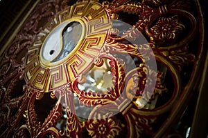 close-up of a metal pattern with a yin-yang symbol