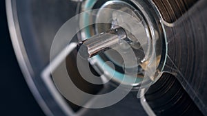 Close up of a metal stem on a revolving reel