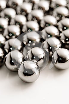 Close up Metallic bearing balls on metal