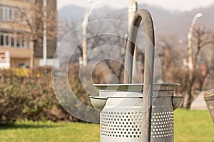 Close-up of metallic grey garbage container