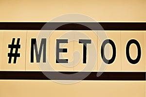 Close up of ` METOO` text in lightbox. Female empowering educational movement.