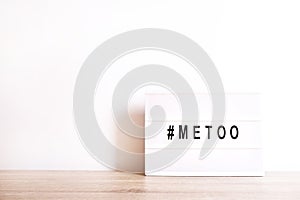 Close up of ` METOO` text in lightbox. Female empowering educational movement.