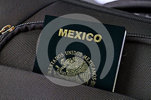 Close up of Mexico Passport in Black Suitcase Pocket