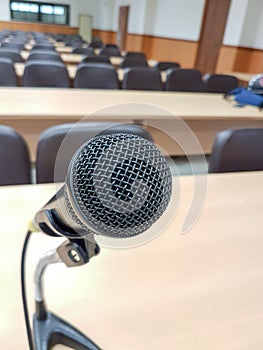 Close up Microphone on background lecture hall