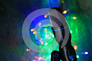 Close up of microphone with colorful bokeh