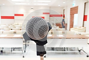 Close up of microphone in concert hall or conference room.