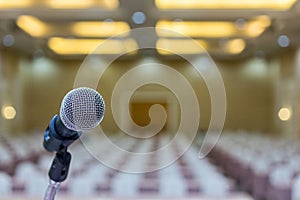 Close up. Microphone in conference hall. Microphone over the Abstract blur photo of seminar room background