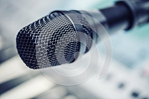 Close-up of microphone in conference room or concert hall