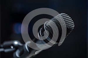 Close-up of microphone in conference room or concert hall