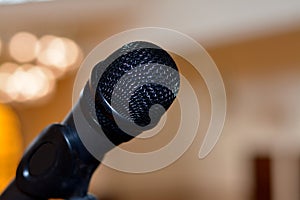 A close up of a microphone in a hall or a conference room, Microphone on a blurred background as in a speech in a seminar room