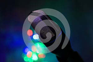 Close up of microphone for live with colorful bokeh