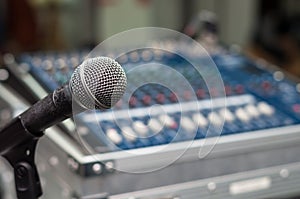 Close up of microphone on mixer blurred background