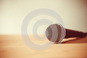 Close up a Microphone on the table, concept of speaker or teacher preparation to speak in seminar class room